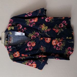 Women's button up blouse.  Size Large. Navy blue flower print.  New with Tags.